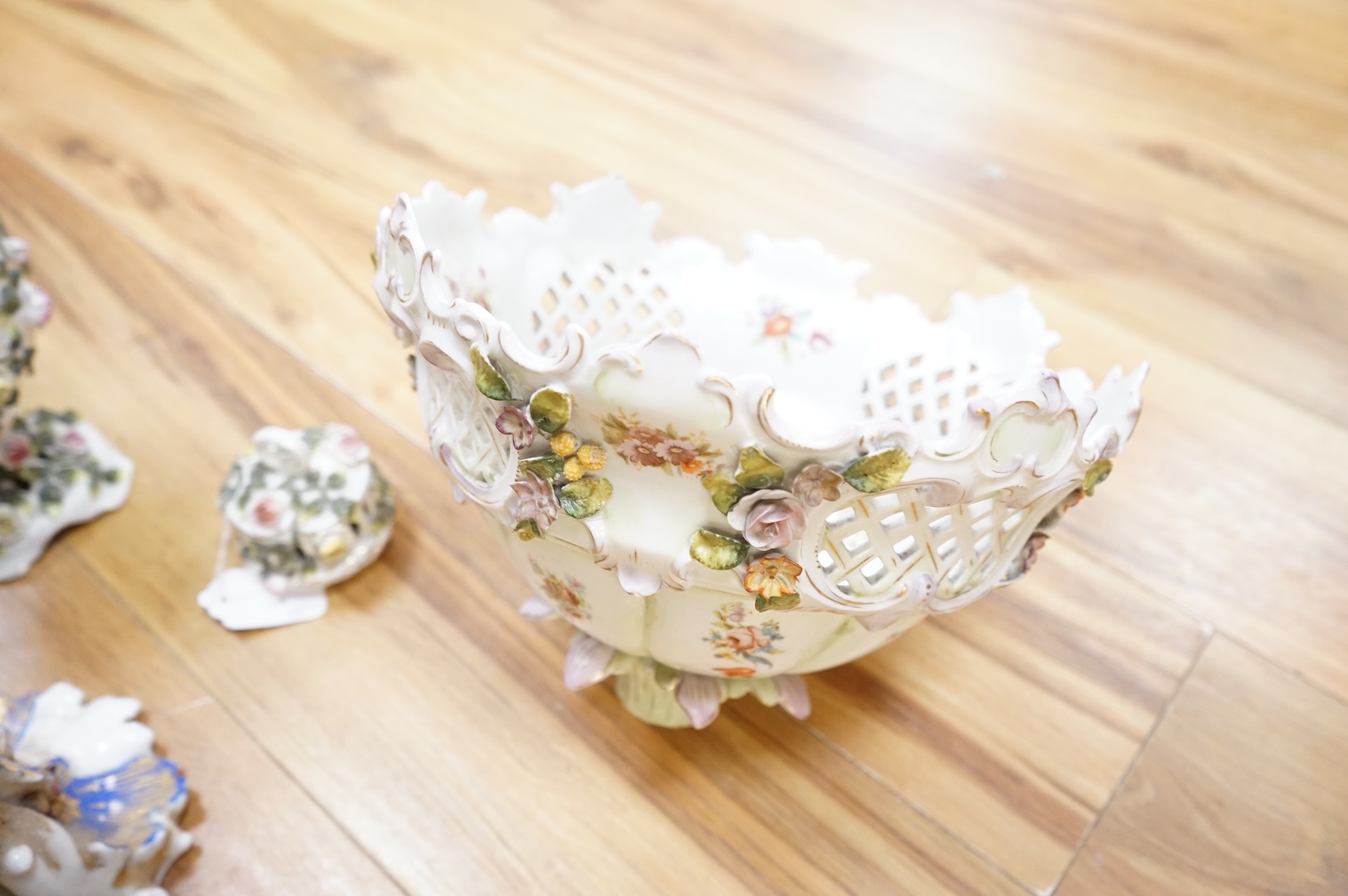 A German porcelain figural centrepiece, lobed dish, three other plates and two others
